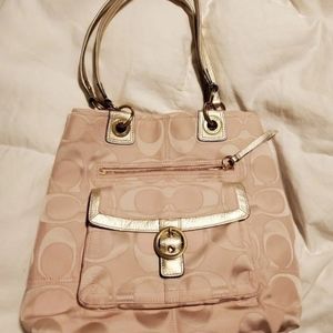 Like new pink with pink satin inside and gold tone